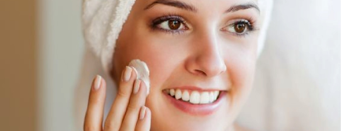 woman-applying-face-cream